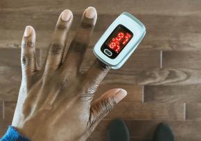 pulse oximeter on index finger